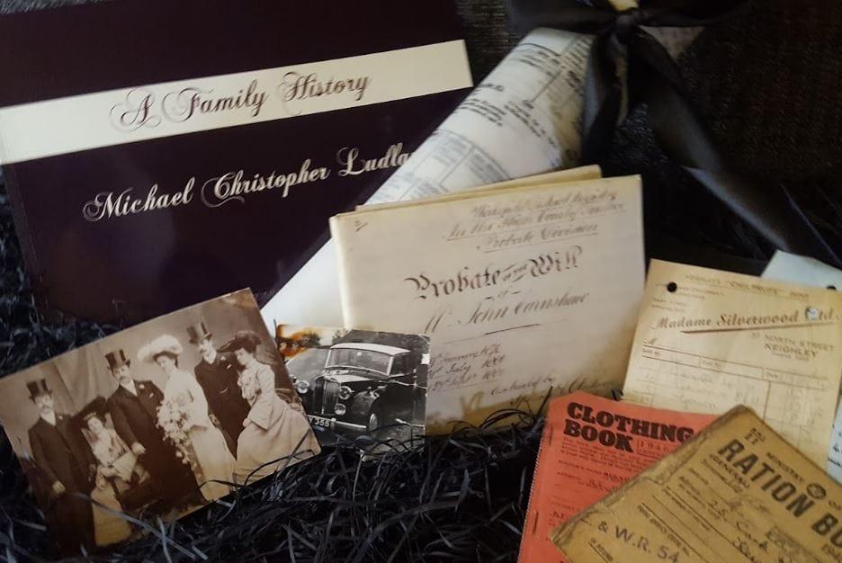 A family history book with old ration books and photographs